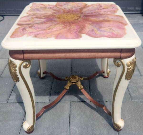 A table with a flower painted on it