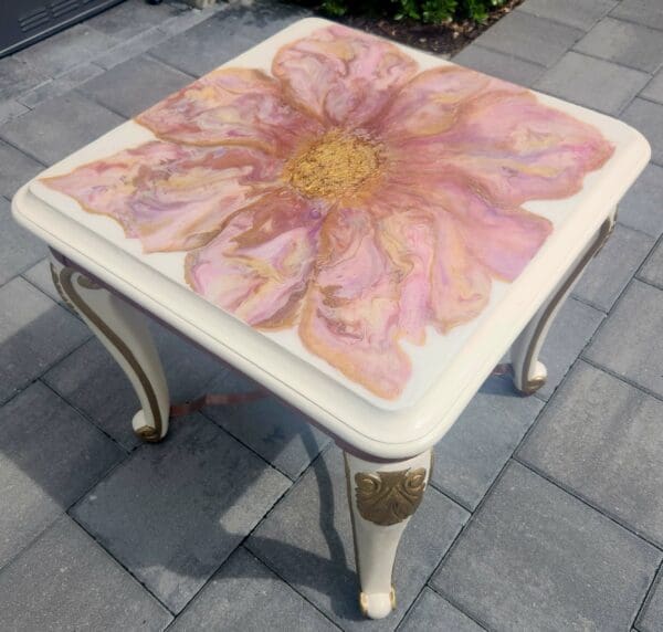 A table with a flower painted on it