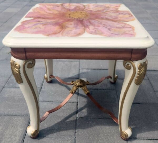 A table with a flower painted on it