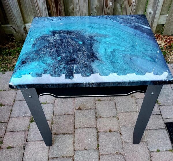 A table with a blue and black design on it.