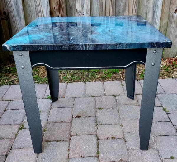 A table that is sitting on the ground.