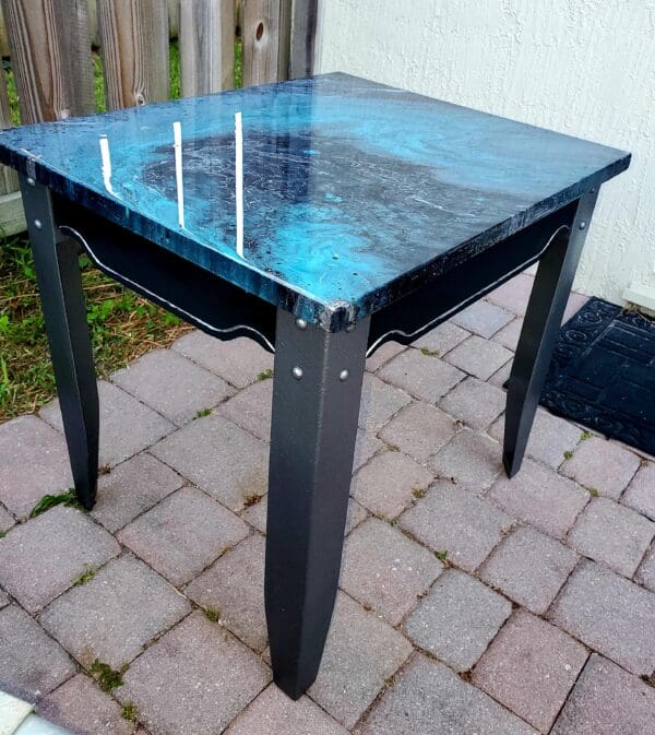 A table that is sitting on the ground.