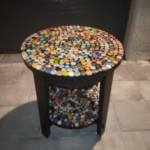 A table with many different colored bottle caps on it.