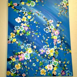 A painting of flowers on the wall