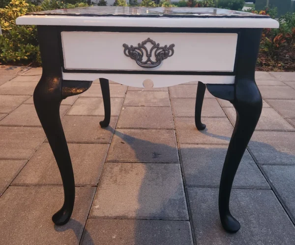 A table with legs and a black base