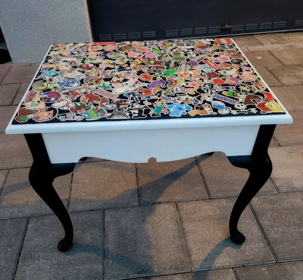 A table with a lot of different stickers on it