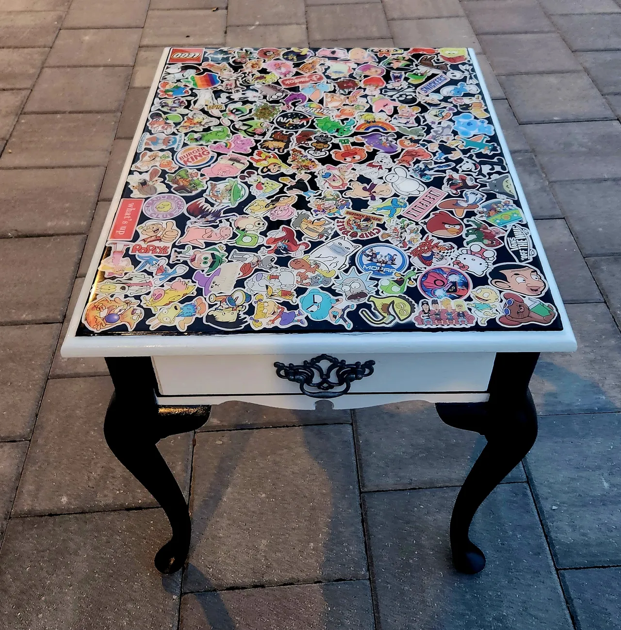 A table with many different kinds of stickers on it.