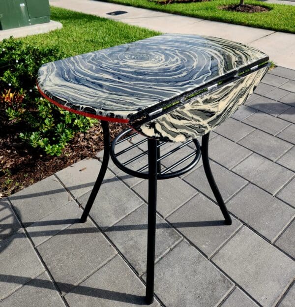 A table that is sitting on the ground.