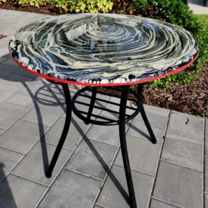 A table with a black and red frame on top of it.