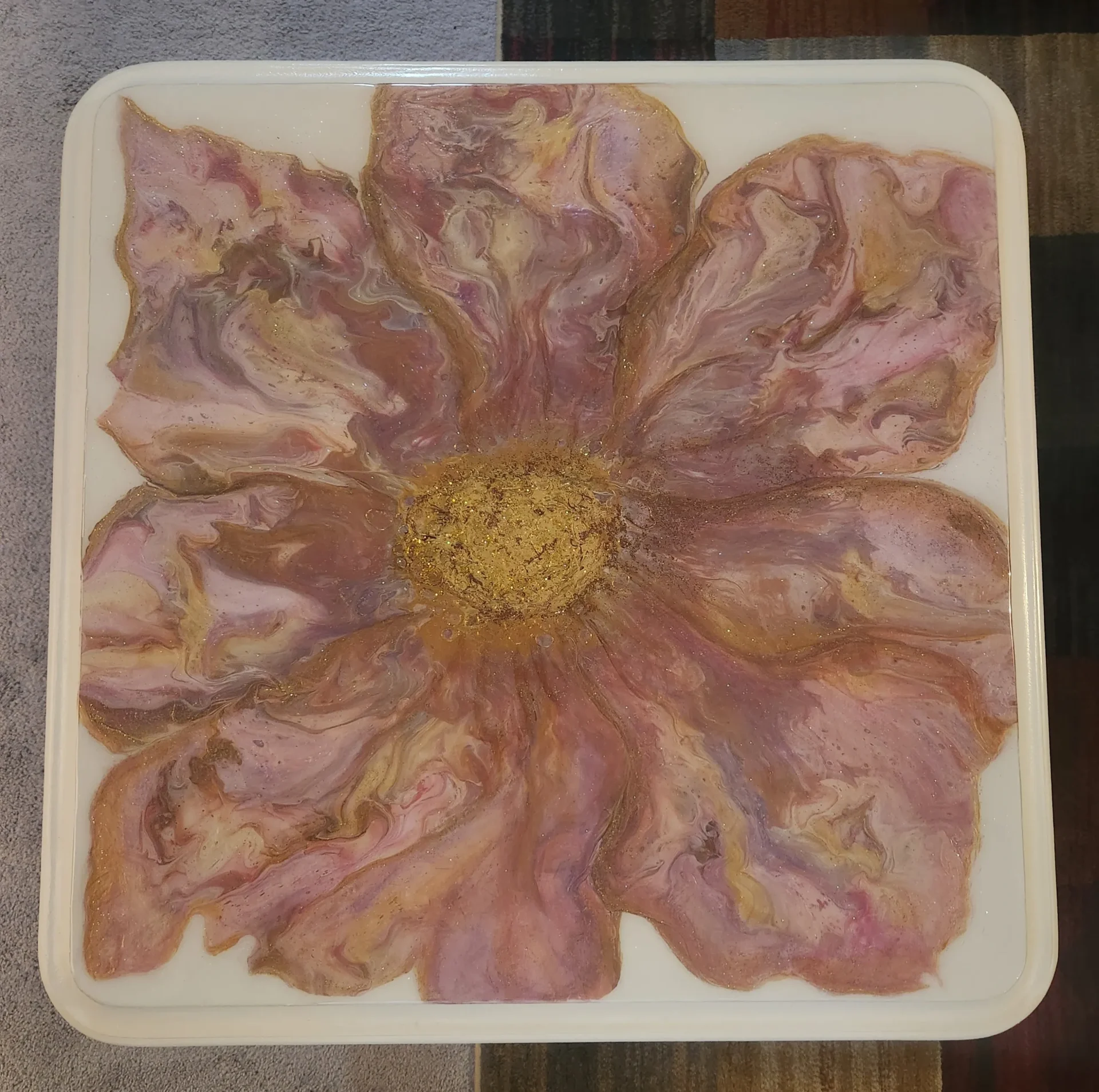 A flower made of bacon on top of a plate.