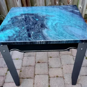 A table with blue and black marble on top.